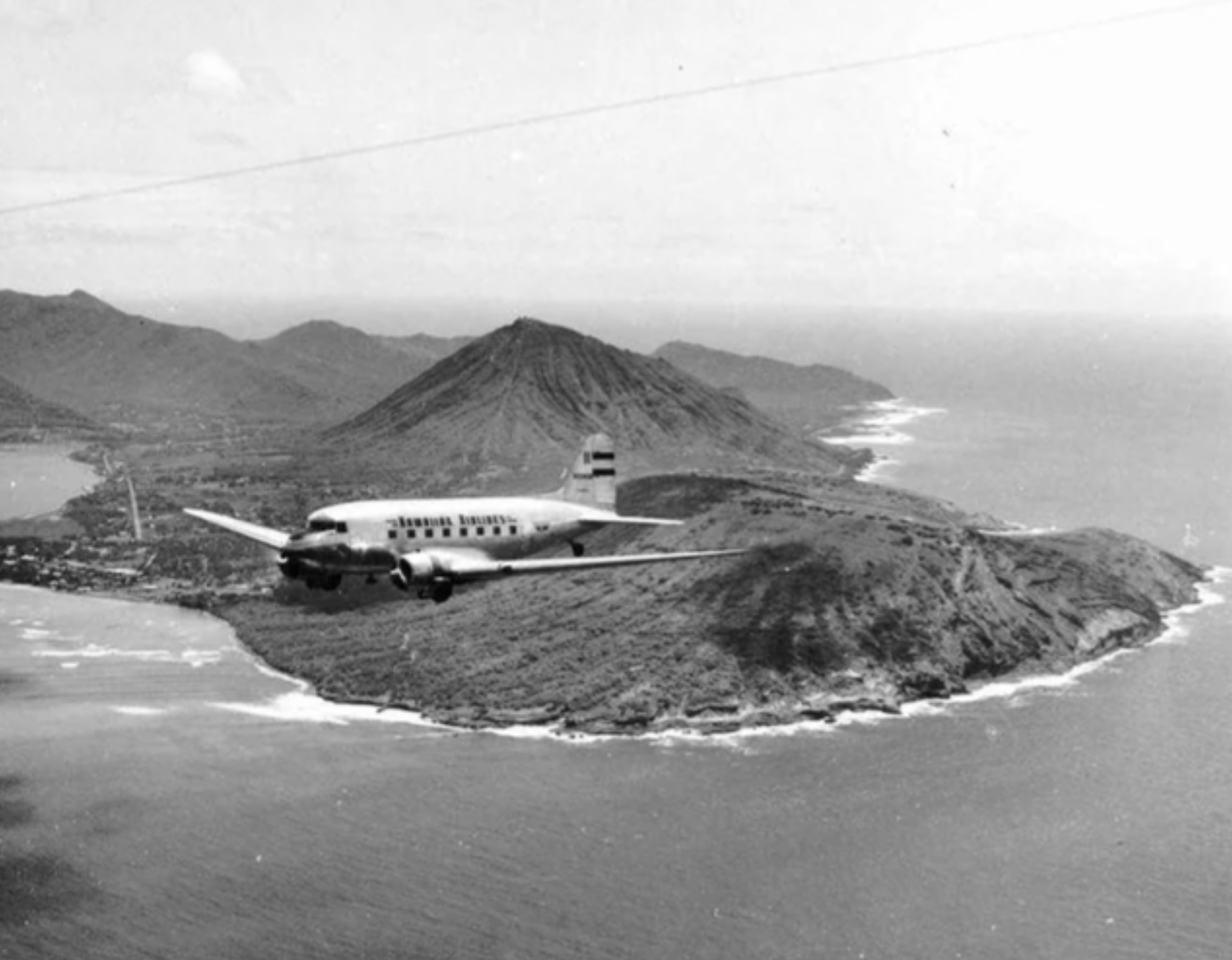 Plane flying over Oahu 